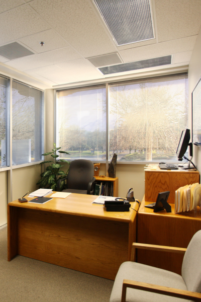 small corner office with desk and chair