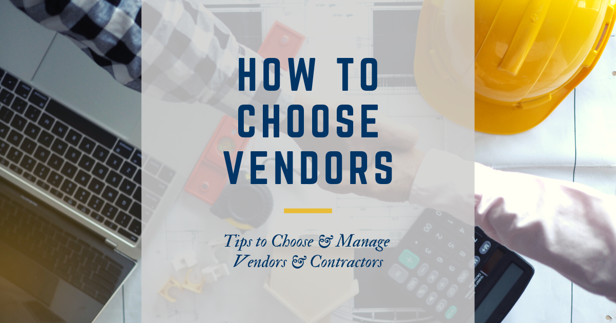 two people shaking hands over laptop, plans, calculator, and hard hat